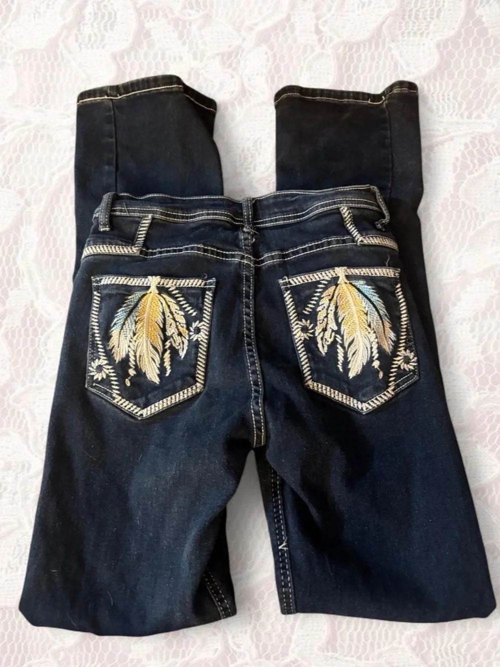 Dark wash feather embroidered boot cut jeans
